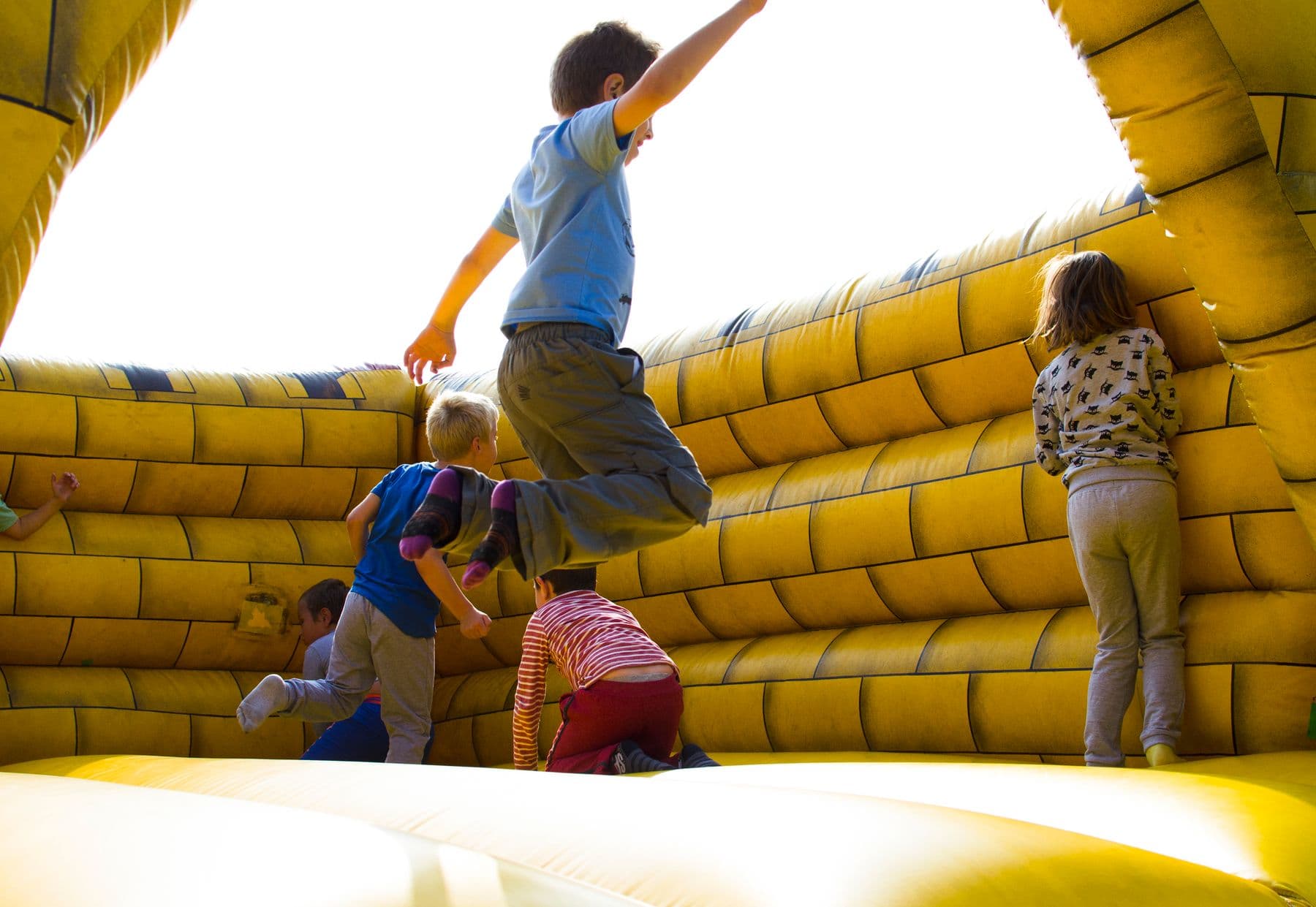 Children enjoying an inflatable bounce house